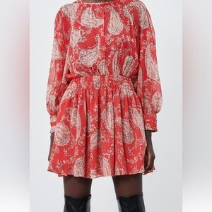 Printed short dress with long sleeves.